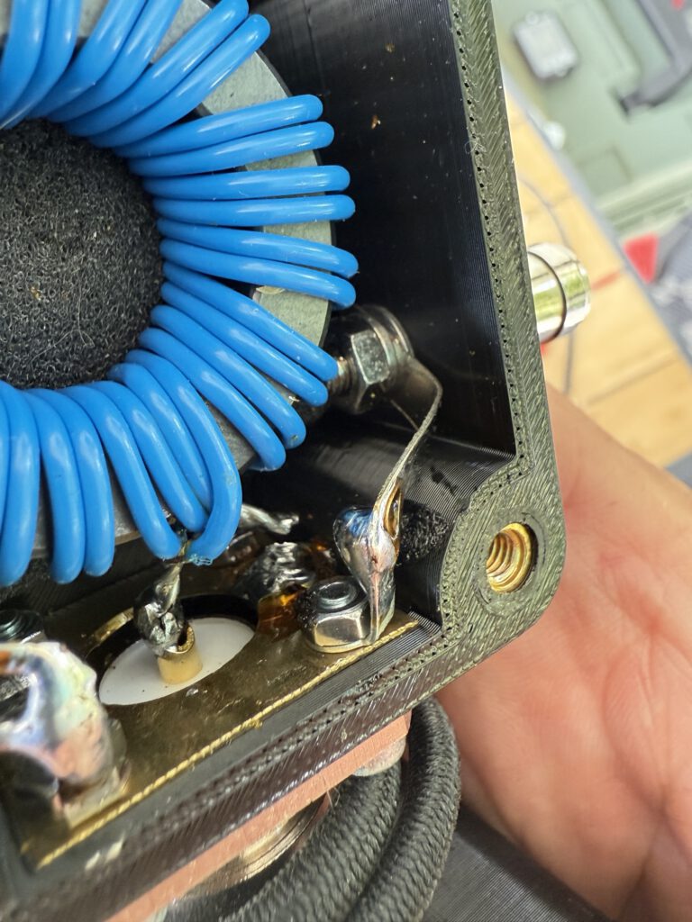 Close-up of the toroid and solder connections in the antenna box