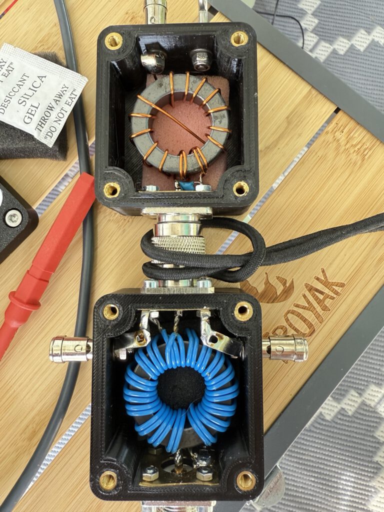 Two antenna boxes with toroids on the work table