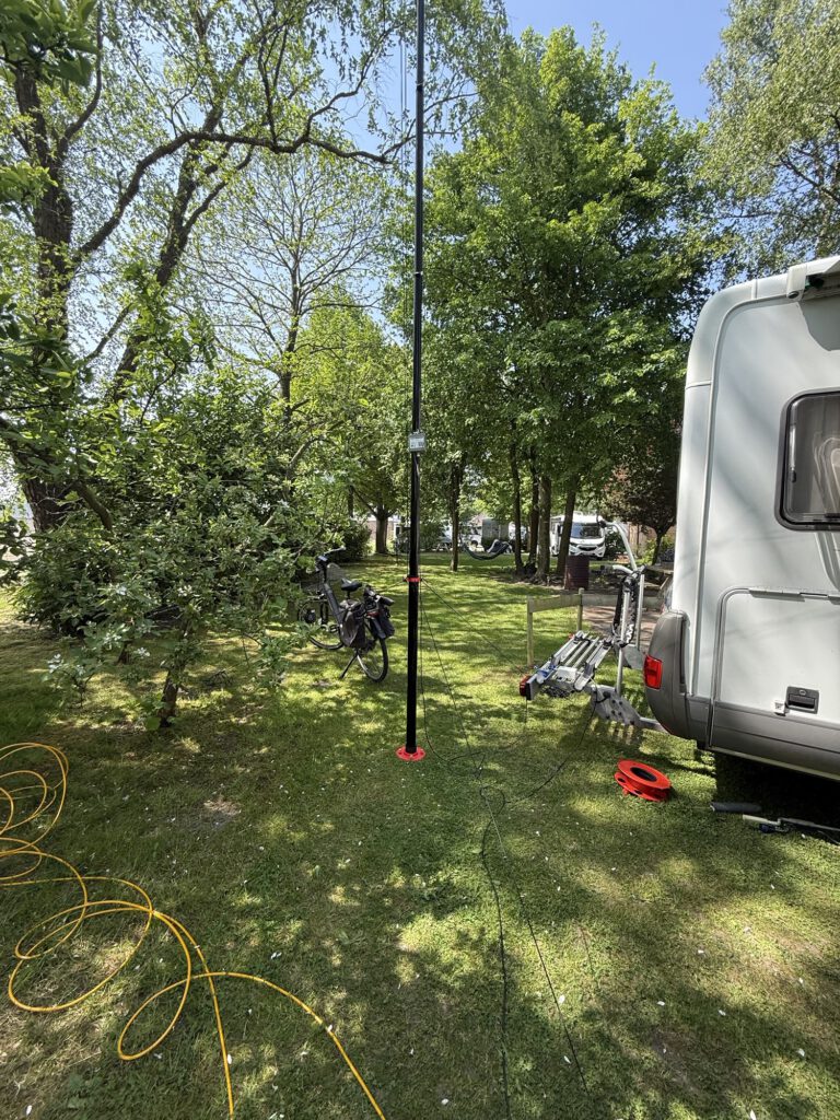 Vertical antenna mast next to the camper