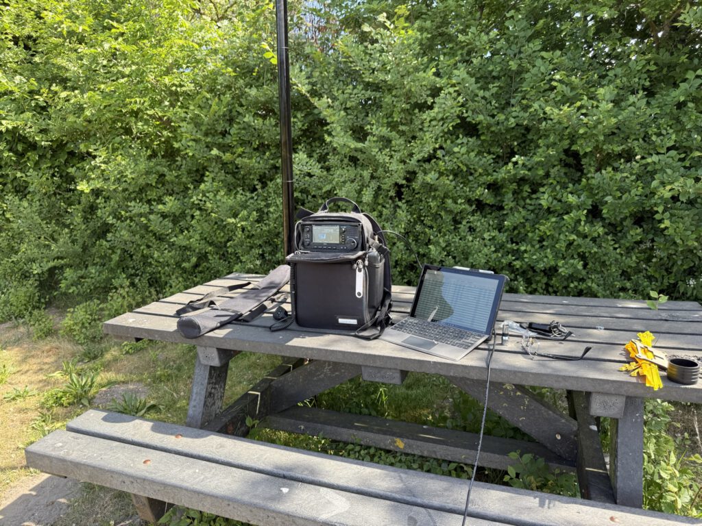 Icom IC-705 and laptop on a picnic table